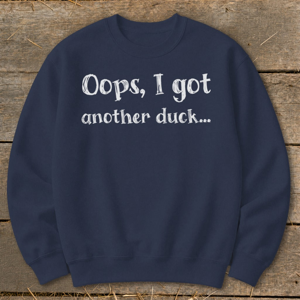 Navy sweatshirt with white text "Oops, I got another duck...".