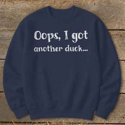 Navy sweatshirt with white text "Oops, I got another duck...".