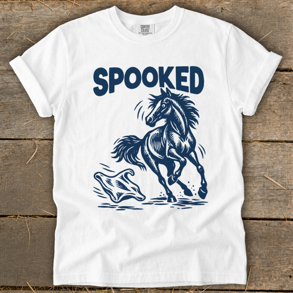 White t-shirt with navy blue graphic of a spooked horse running from a ghost, text "SPOOKED".
