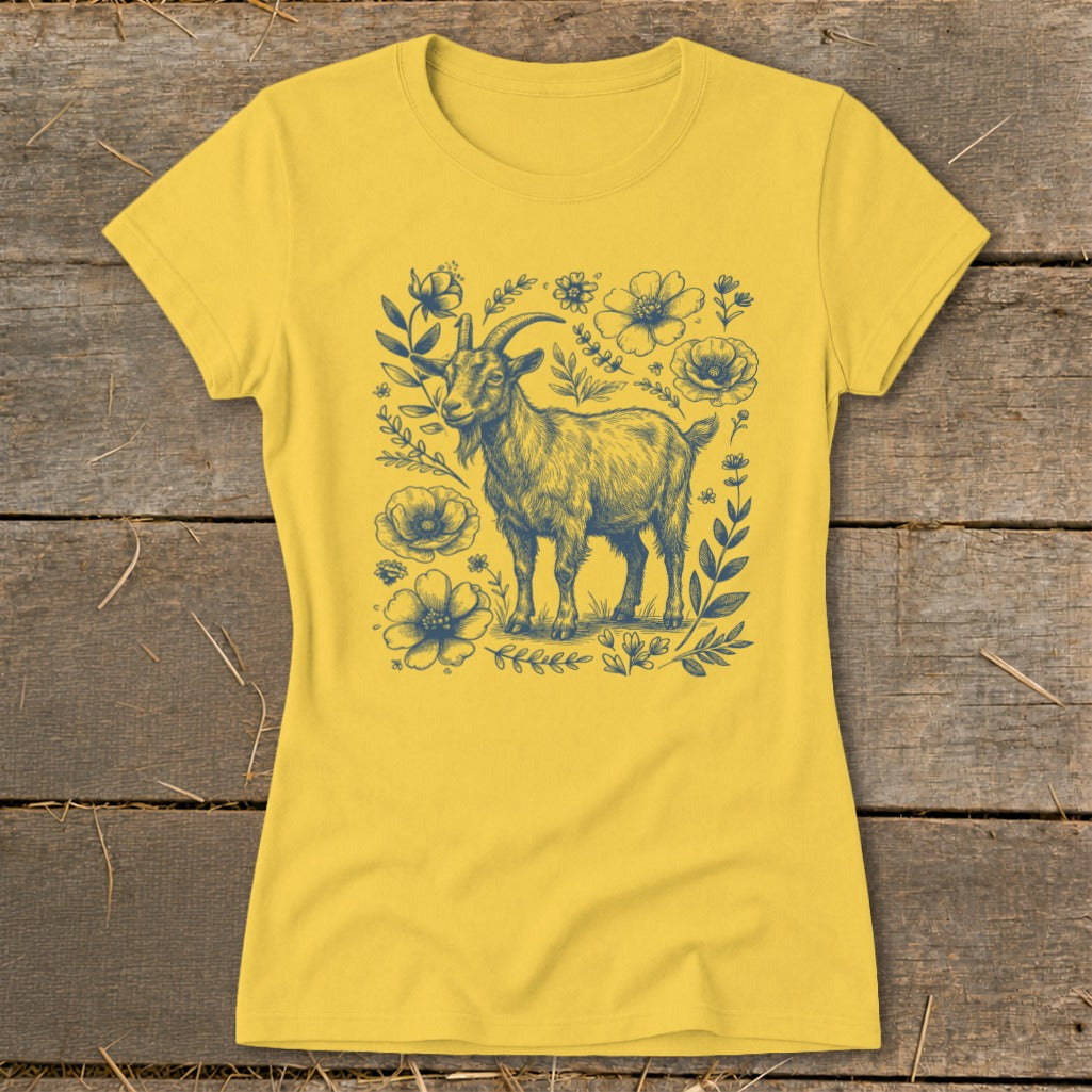 Yellow t-shirt with a dark blue line drawing of a goat surrounded by flowers and leaves.