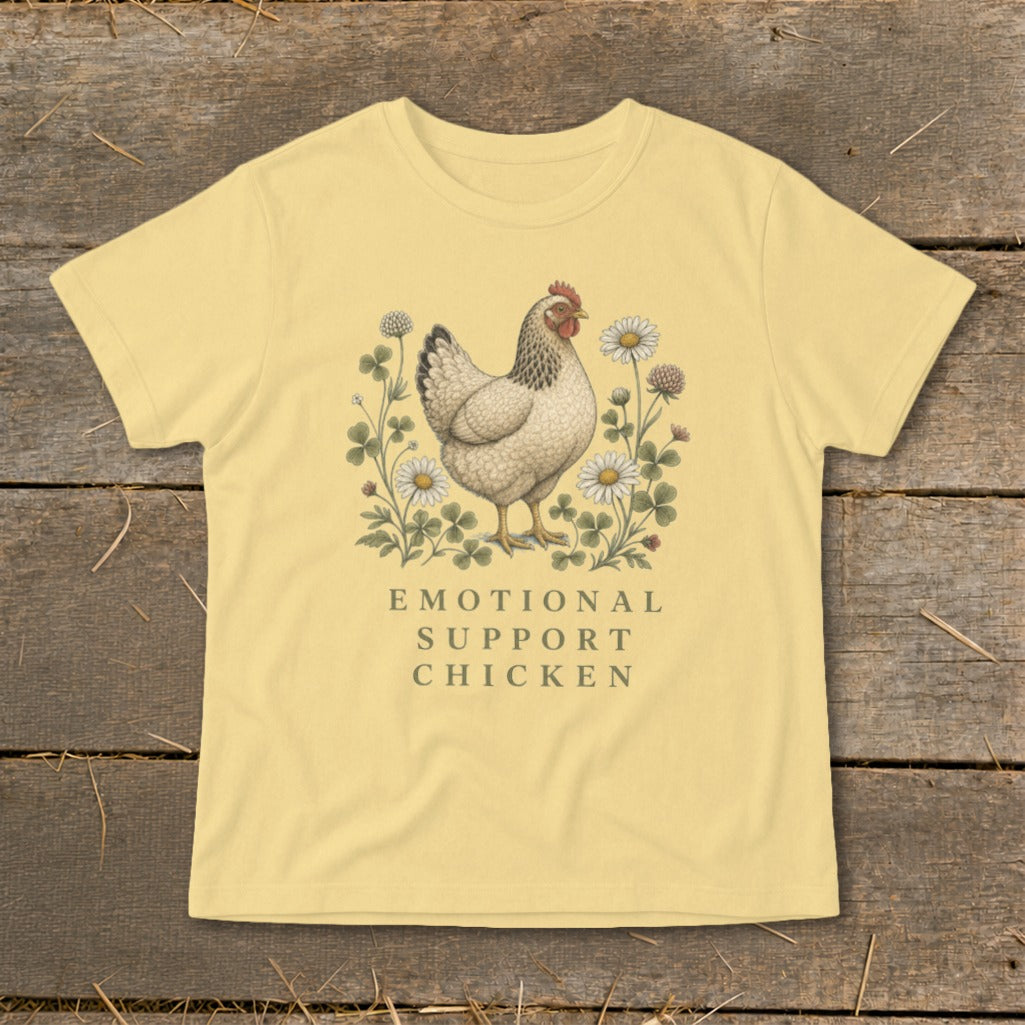 Yellow t-shirt with a vintage chicken illustration and the text "EMOTIONAL SUPPORT CHICKEN".