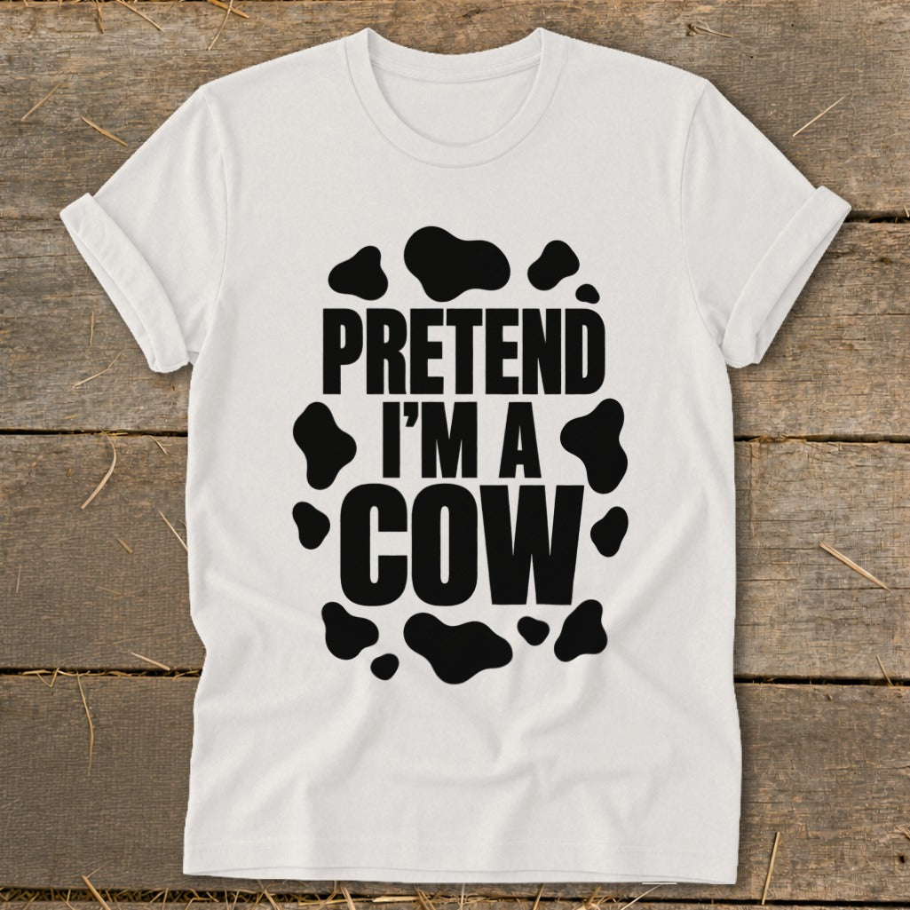 White t-shirt with black cow spots and text that reads "PRETEND I'M A COW".