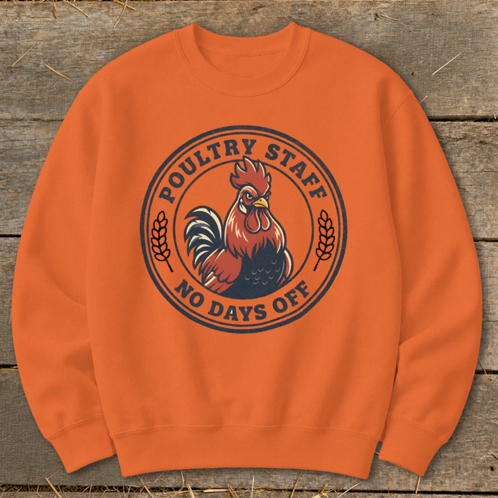 Orange sweatshirt with a circular graphic of a rooster and "Poultry Staff No Days Off".
