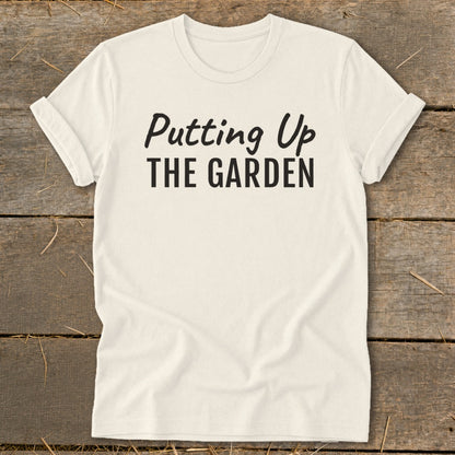 Cream t-shirt with black text reading "Putting Up THE GARDEN".