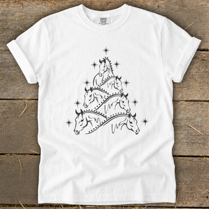 White t-shirt with a stylized Christmas tree formed by horses and stars.