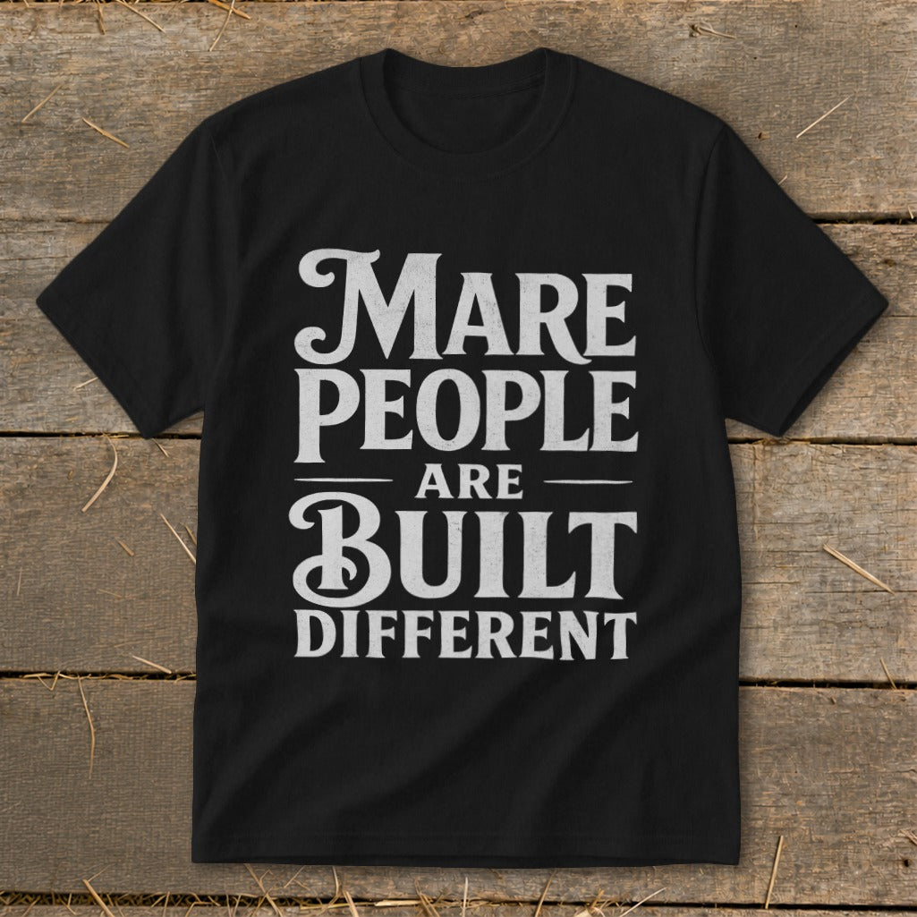 Black t-shirt with white text: "Mare People Are Built Different."