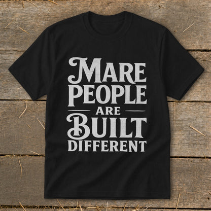 Black t-shirt with white text: "Mare People Are Built Different."