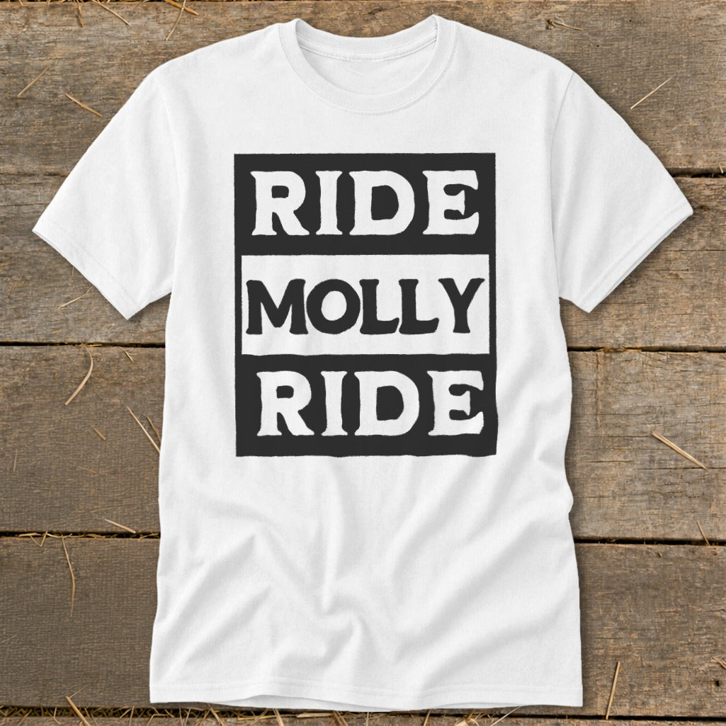 A white t-shirt laid flat on a rustic wooden surface, featuring black block text that reads Ride Molly Ride.