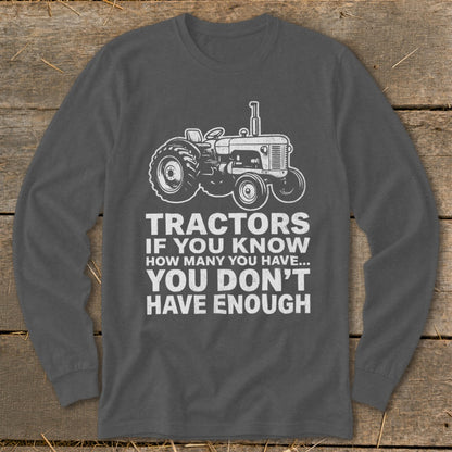 Long sleeve shirt with a tractor graphic and text: "Tractors if you know how many you have... you don't have enough."