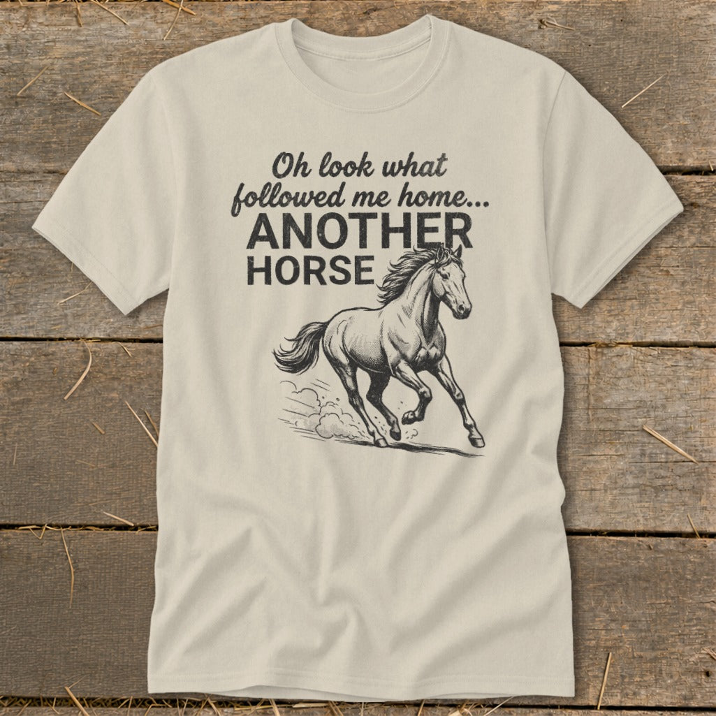 Cream t-shirt with "Oh look what followed me home... ANOTHER HORSE" and a horse illustration.