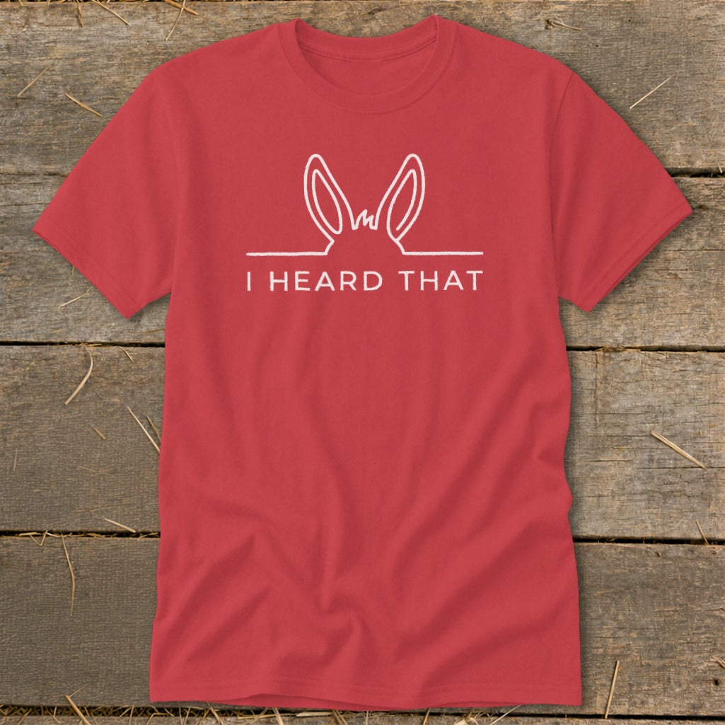 Red t-shirt with white text "I HEARD THAT" and bunny ears graphic.