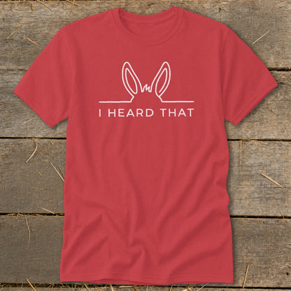 Red t-shirt with white text "I HEARD THAT" and bunny ears graphic.