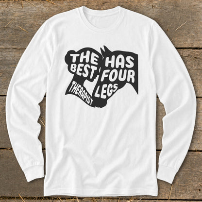 White long sleeve shirt with black text and horse silhouettes: "The best therapist has four legs."