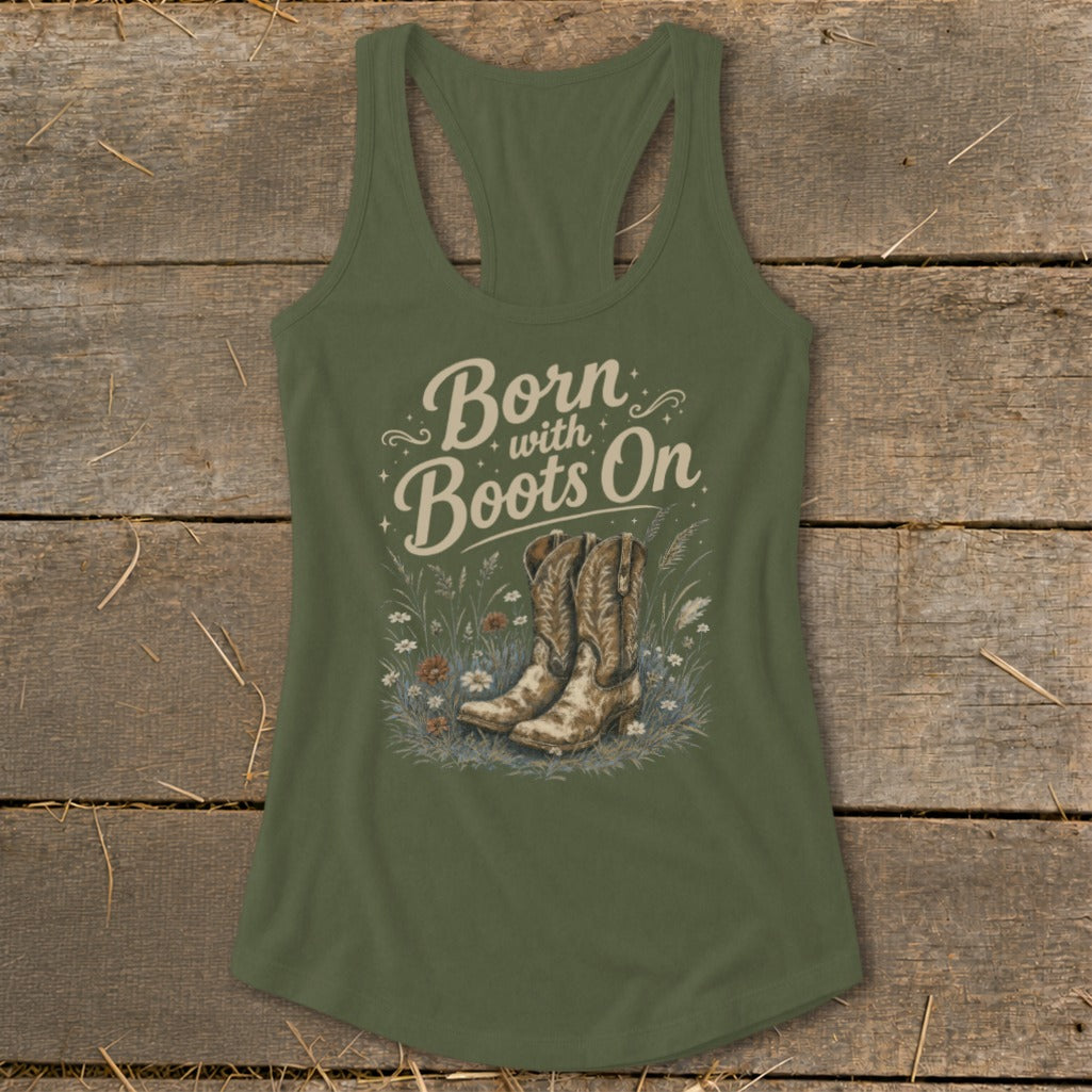 Olive green tank top with "Born with Boots On" text and cowboy boots in grass.
