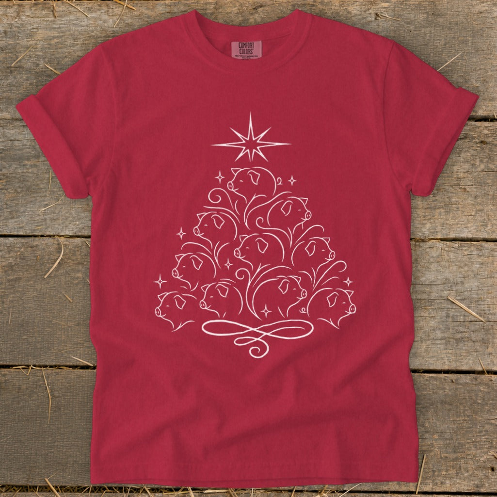 Red t-shirt with white line art of pigs forming a Christmas tree shape.