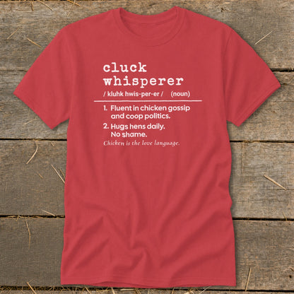 Red t-shirt with "Cluck Whisperer" definition in white text.