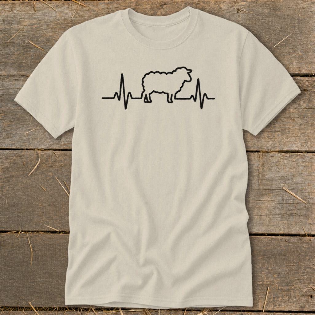 Light beige t-shirt featuring a black graphic of a sheep silhouette with a heartbeat line passing through it.