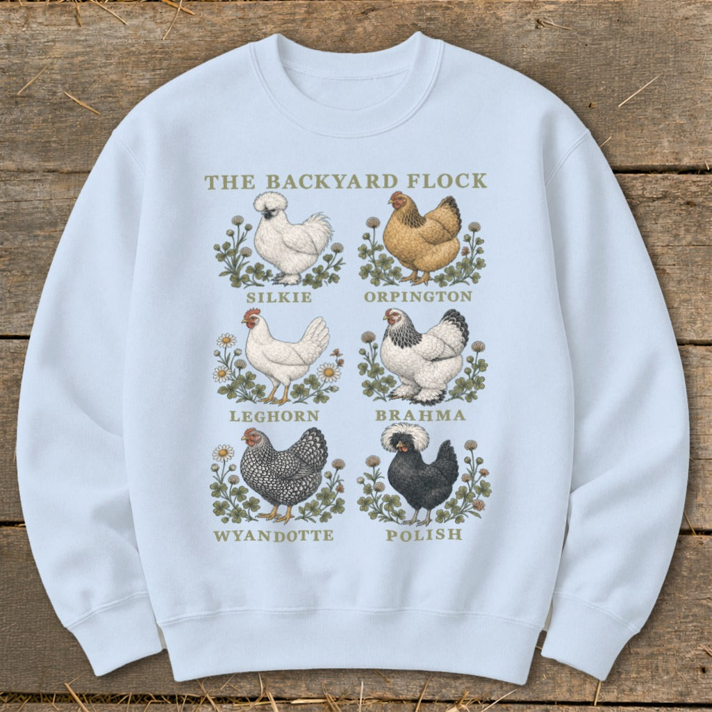 Light blue sweatshirt with "The Backyard Flock" and illustrations of six chicken breeds.