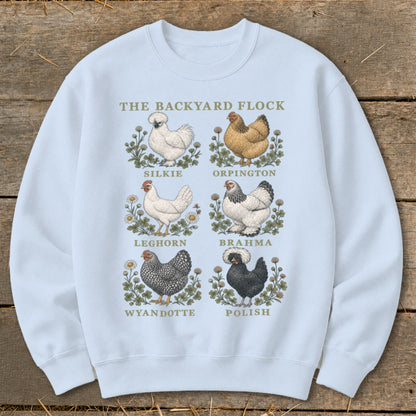 Light blue sweatshirt with "The Backyard Flock" and illustrations of six chicken breeds.