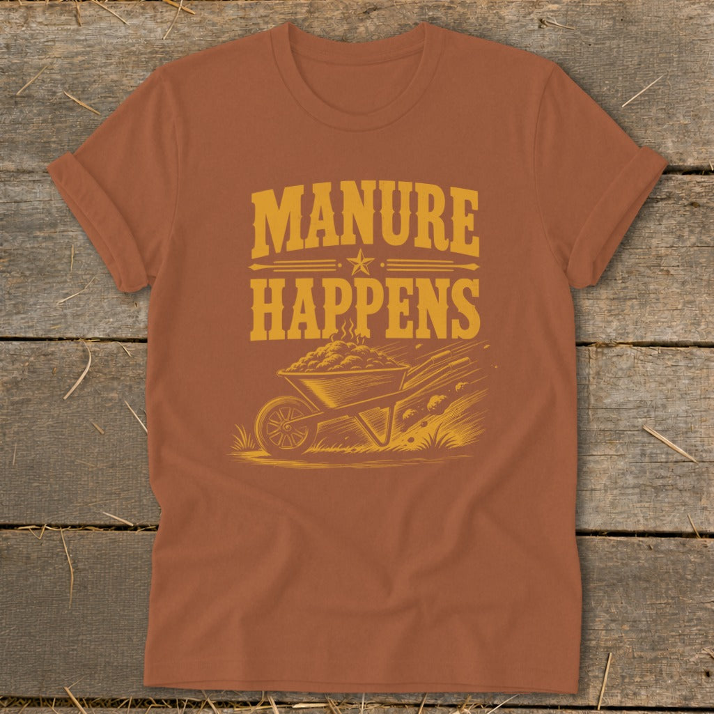 Orange t-shirt with "Manure Happens" text and a wheelbarrow full of manure.