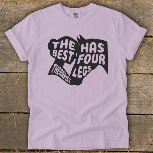 Light purple t-shirt with "The Best Therapist Has Four Legs" text and horse silhouette graphic.
