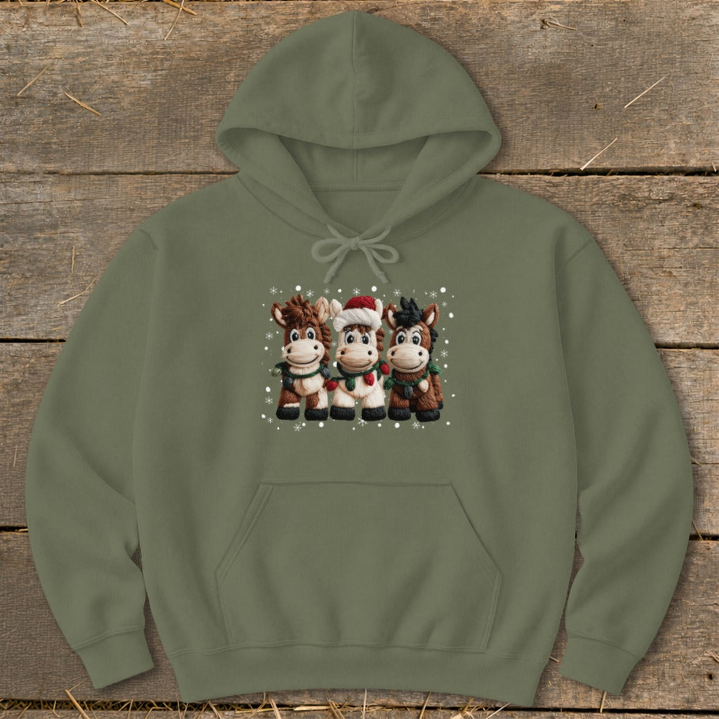 Olive green hoodie with three cartoon horses wearing Christmas lights and scarves.