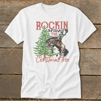 White t-shirt with "Rockin around the Christmas Tree" text and cowboy on bucking horse.