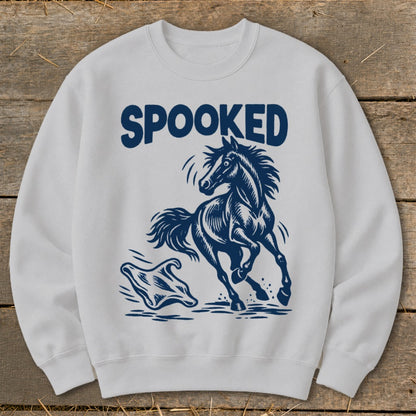 White sweatshirt with navy blue text "SPOOKED" and graphic of a startled horse and ghost.