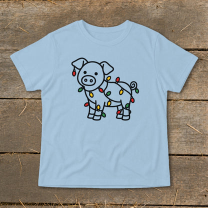 Light blue t-shirt featuring a line drawing of a pig tangled in colorful Christmas lights.
