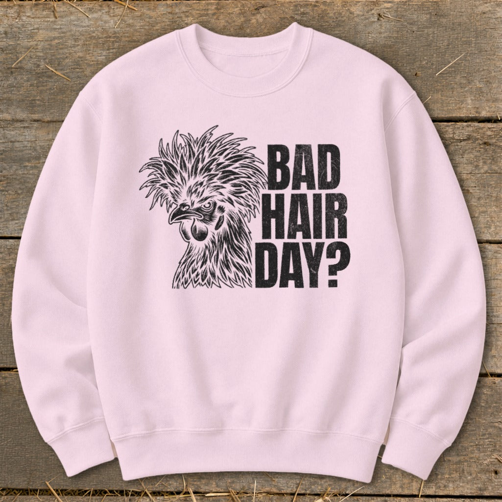 Light pink sweatshirt with a distressed chicken graphic and "BAD HAIR DAY?" text.