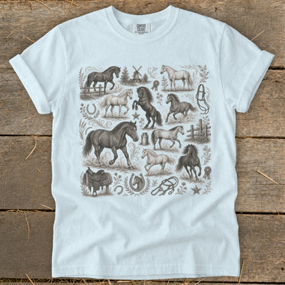 White t-shirt with vintage equine illustrations including horses, saddle, horseshoe, and windmill.