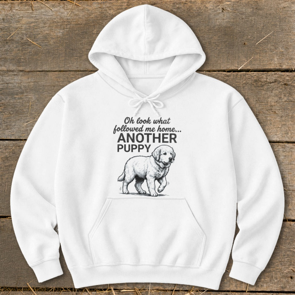 White hoodie with a drawing of a puppy and the text "Oh look what followed me home... ANOTHER PUPPY".