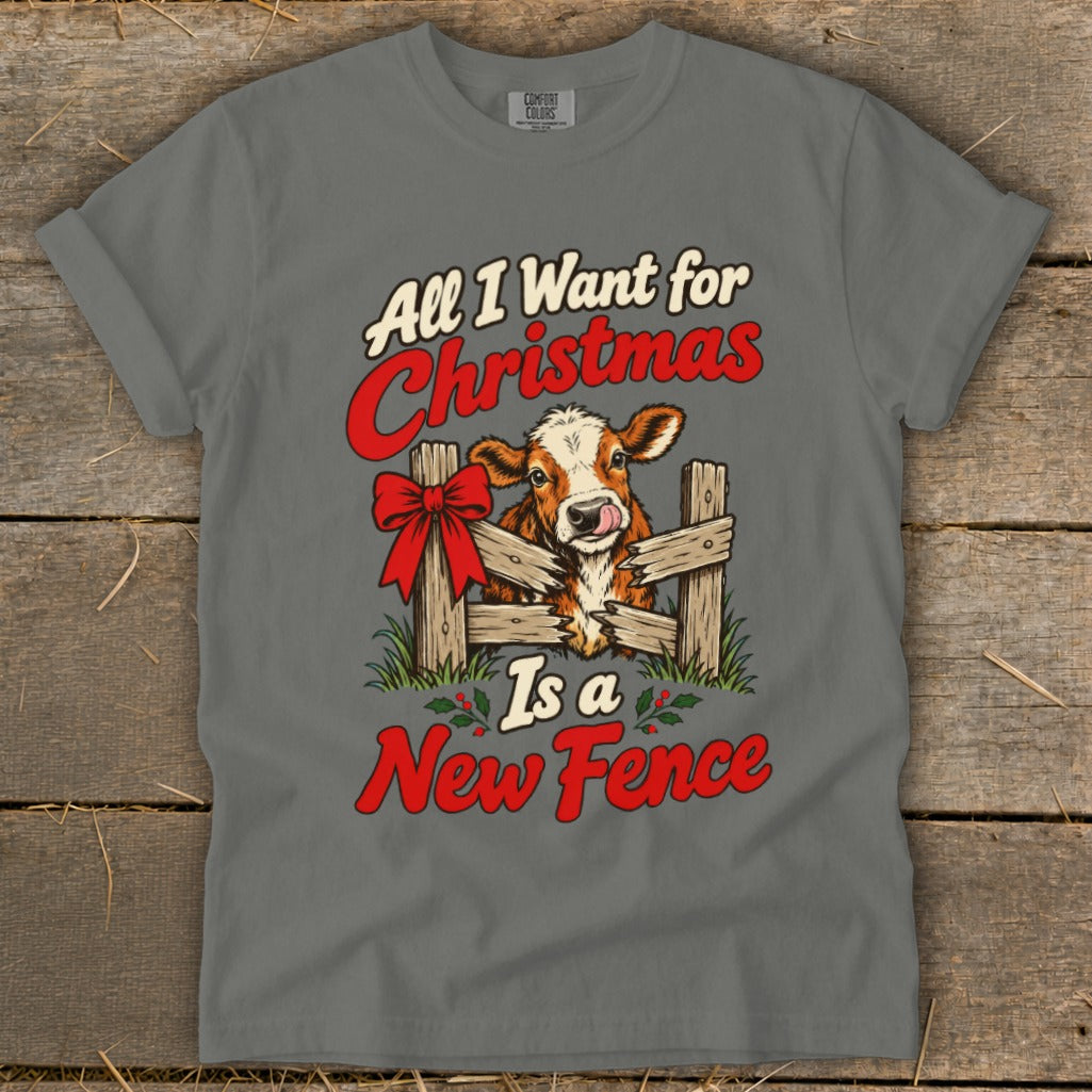 Grey t-shirt with a cow behind a broken fence and text "All I Want for Christmas Is a New Fence".