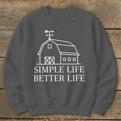 Dark gray sweatshirt with white barn graphic and text "SIMPLE LIFE BETTER LIFE".