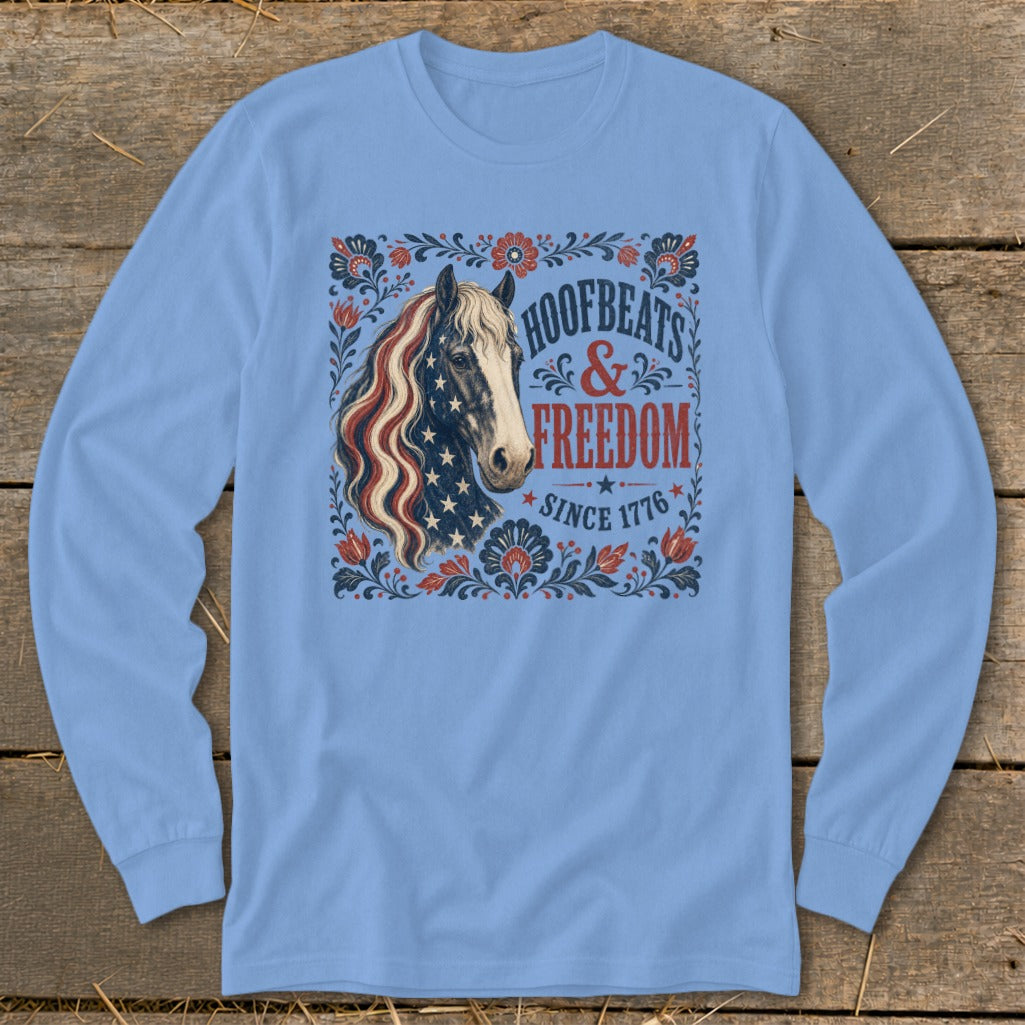 Light blue long-sleeve shirt with American flag-maned horse and "Hoofbeats & Freedom Since 1776" text.