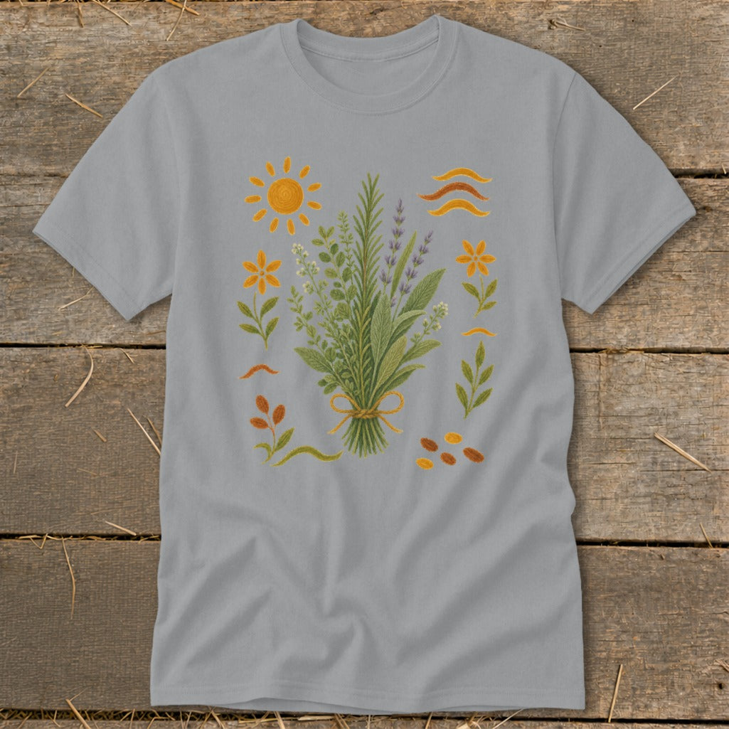 Gray t-shirt with embroidered bouquet of herbs, flowers, sun, and wavy lines.