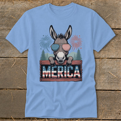 Donkey wearing American flag sunglasses holds "MERICA" sign with fireworks.