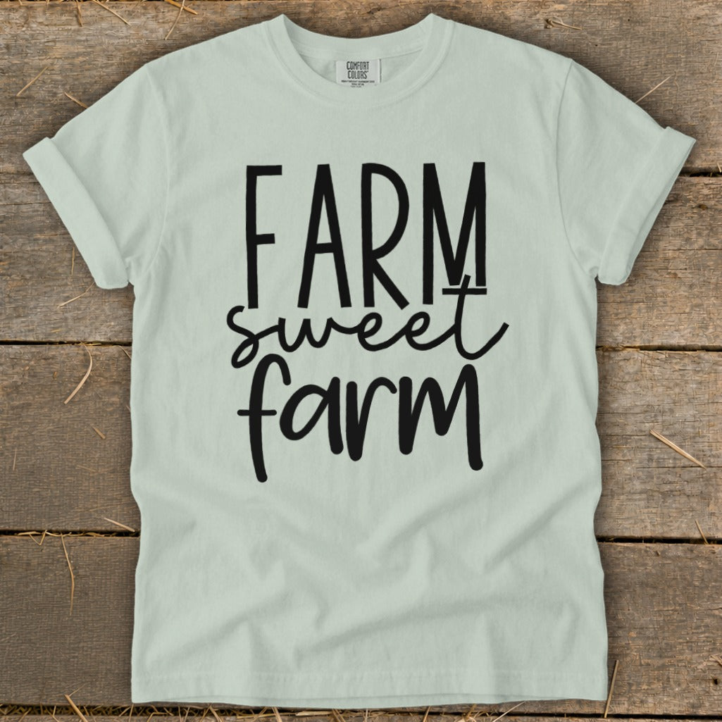 Light green t-shirt with black text reading "FARM sweet farm".