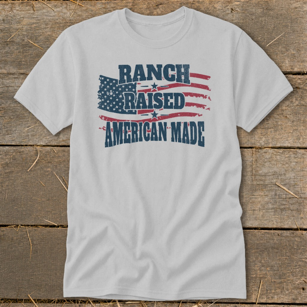 Light grey t-shirt with distressed American flag graphic and text "Ranch Raised American Made".