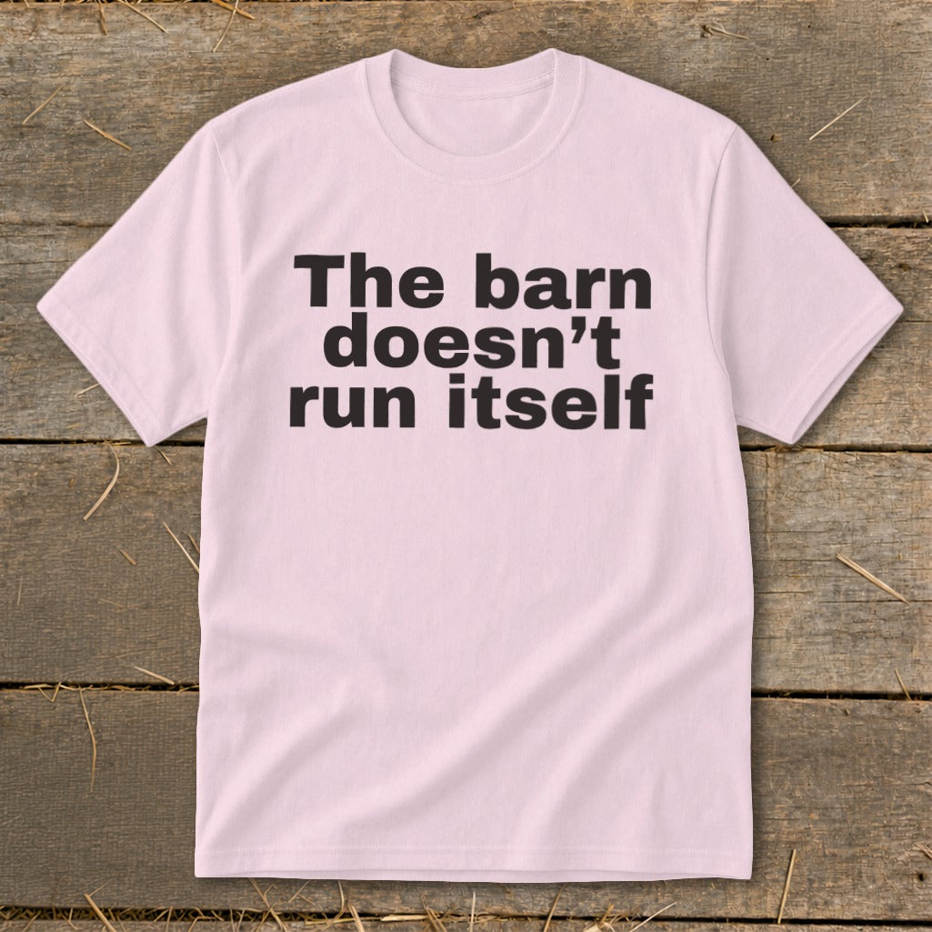 Pink t-shirt with black text reading "The barn doesn't run itself".