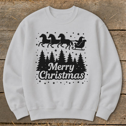 White sweatshirt with black Christmas design: Santa's sleigh pulled by horses over trees.
