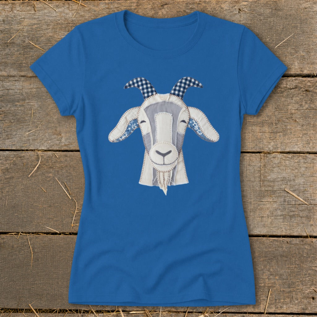 Blue t-shirt with a stitched goat face applique featuring checkered horns.