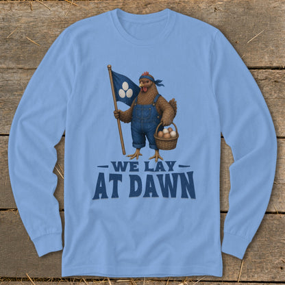 Chicken in overalls holding a flag and basket of eggs with text "We Lay At Dawn".