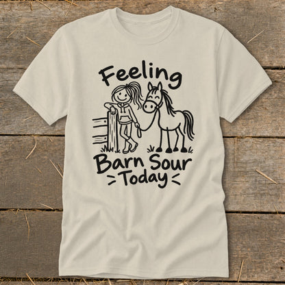 T-shirt with black graphic of a girl, horse, fence, and text "Feeling Barn Sour Today".