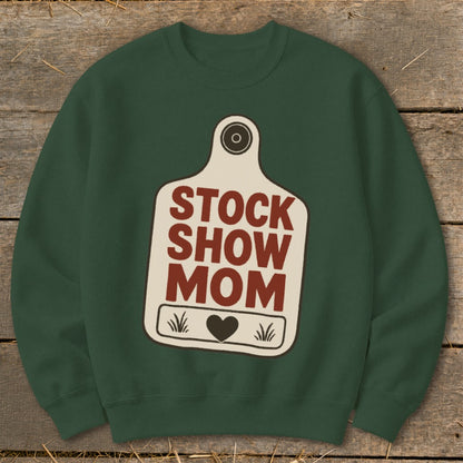 Green sweatshirt with a cream tag design that reads "STOCK SHOW MOM".