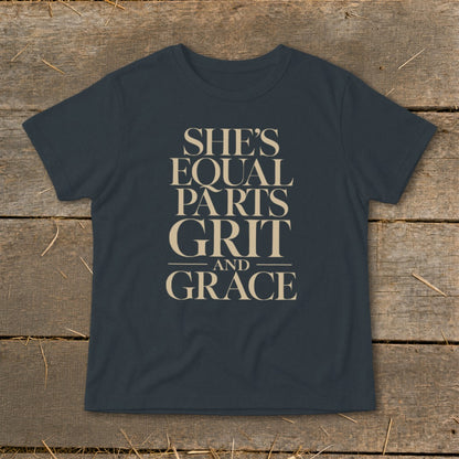 Dark t-shirt with text "She's Equal Parts Grit and Grace".