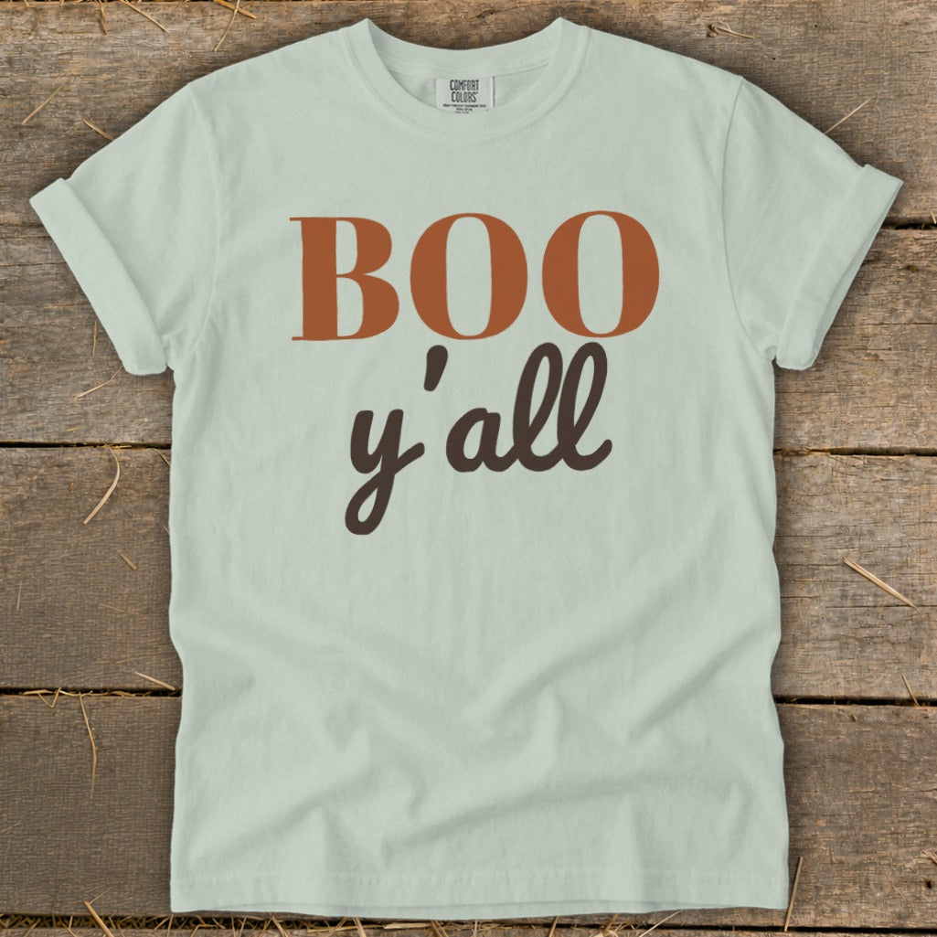 Light green t-shirt with "BOO y'all" in brown and copper lettering.