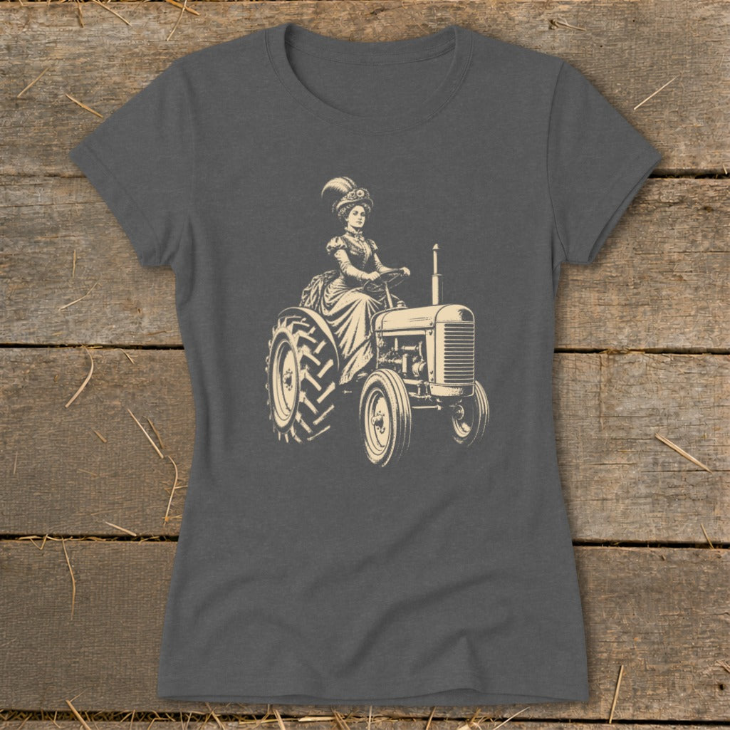 Steampunk woman in ornate hat driving a vintage tractor.