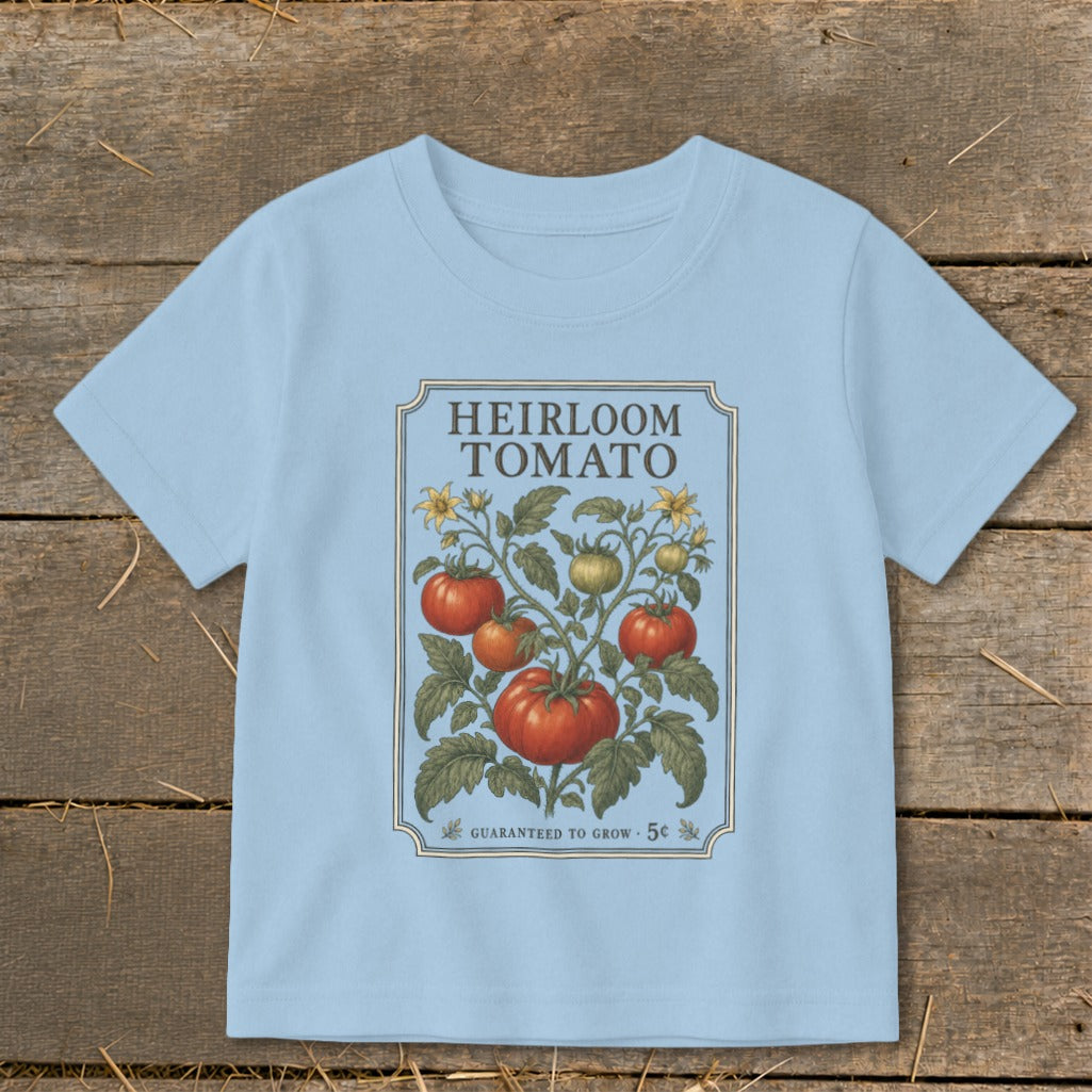 Light blue t-shirt with "Heirloom Tomato" graphic featuring a tomato plant and vine.