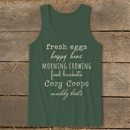 Green tank top with text: fresh eggs, happy hens, morning crowing, feed buckets, cozy coops, muddy boots.